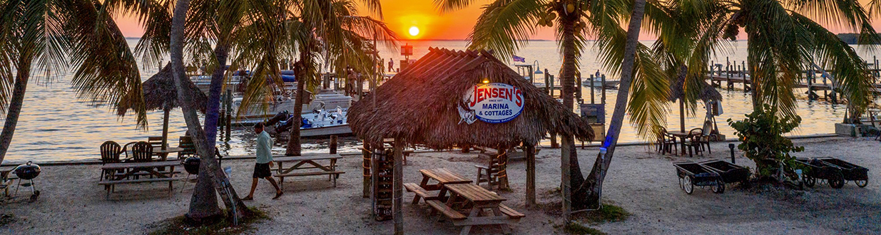 Jensen's Marina tiki hut at dusk jensens-marina-old-florida-feel